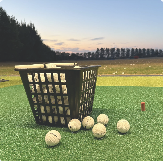 Basket and golf balls ready for an evening practice session